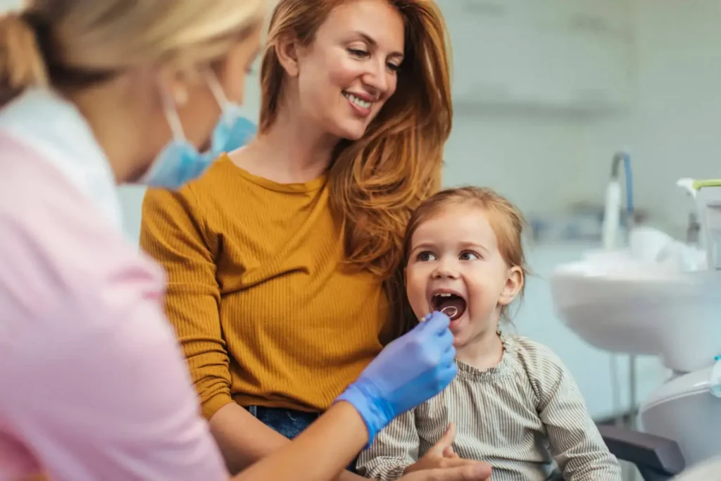Mother and daughter at the dentist.